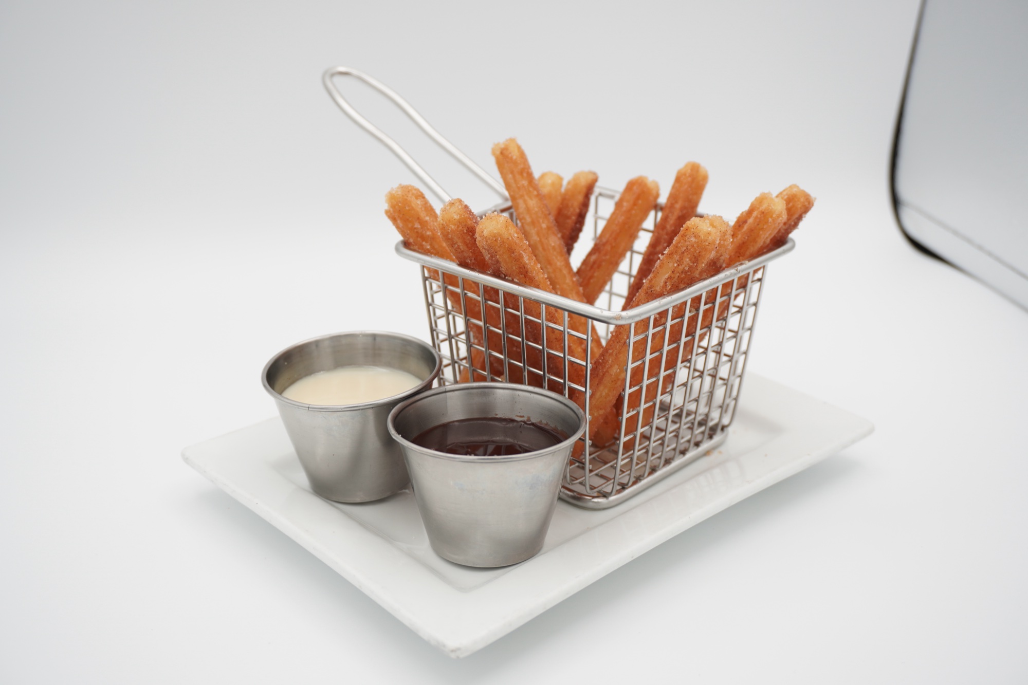 Studio churros photography with dipping sauces